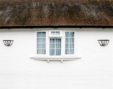 empty room with glass door - White brick wall with an External Window under a roof Stock Photo - Budget Royalty-Free & Subscription, Code: 400-05715758