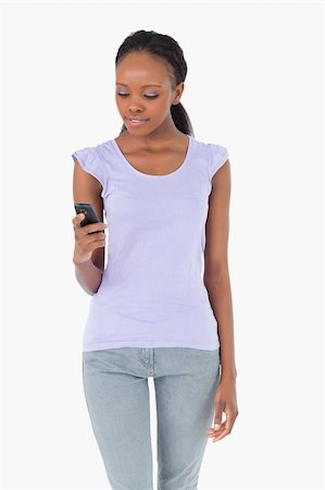 simsearch:400-05717420,k - Close up of young woman texting on white background Stock Photo - Budget Royalty-Free & Subscription, Code: 400-05717341