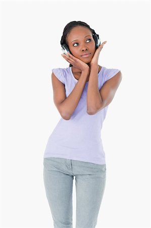 simsearch:400-05717451,k - Close up of young woman enjoying music with headphones on white background Stock Photo - Budget Royalty-Free & Subscription, Code: 400-05717356