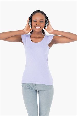 simsearch:400-05717451,k - Close up of smiling woman enjoying music on white background Stock Photo - Budget Royalty-Free & Subscription, Code: 400-05717350