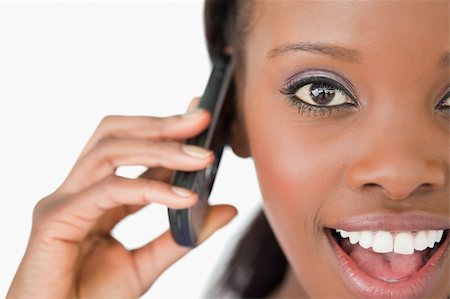 simsearch:400-05717423,k - Close up of surprised young woman on the phone on white background Stock Photo - Budget Royalty-Free & Subscription, Code: 400-05717432