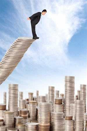 simsearch:400-04529024,k - surprised businessman standing on the money stairs and watching many coin towers Stock Photo - Budget Royalty-Free & Subscription, Code: 400-05717829