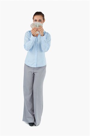 simsearch:400-05715208,k - Businesswoman smelling banknotes against a white background Stock Photo - Budget Royalty-Free & Subscription, Code: 400-05718159