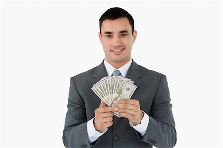 simsearch:400-05715208,k - Businessman with bank notes against a white background Stock Photo - Budget Royalty-Free & Subscription, Code: 400-05718322