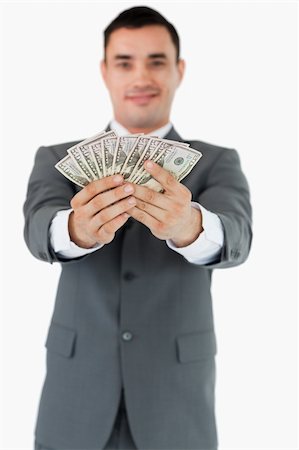 simsearch:400-05715207,k - Businessman presenting his banknotes against a white background Stock Photo - Budget Royalty-Free & Subscription, Code: 400-05718337