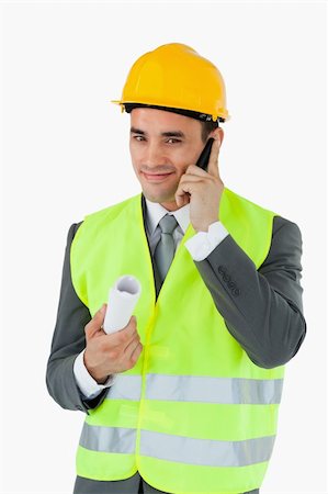 Smiling architect on the phone against a white background Stock Photo - Budget Royalty-Free & Subscription, Code: 400-05718354