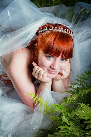 Redhead bride lying on the green grass Stock Photo - Budget Royalty-Free & Subscription, Code: 400-05719758