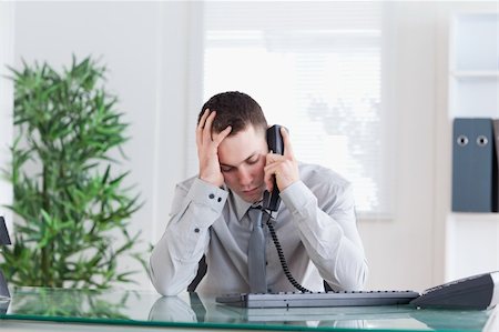 simsearch:400-05710264,k - Disappointed businessman getting sad news on the phone Stock Photo - Budget Royalty-Free & Subscription, Code: 400-05710244