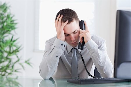 simsearch:400-05710264,k - Close up of sad businessman getting bad news on the phone Stock Photo - Budget Royalty-Free & Subscription, Code: 400-05710245