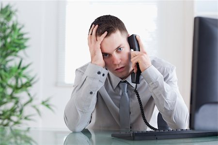 simsearch:400-05710264,k - Close up of disappointed businessman getting sad news on the phone Stock Photo - Budget Royalty-Free & Subscription, Code: 400-05710246