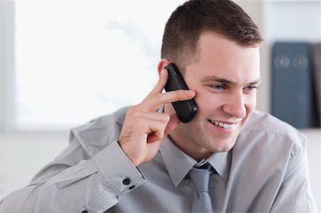 simsearch:400-05710264,k - Smiling businessman talking on the cellphone Stock Photo - Budget Royalty-Free & Subscription, Code: 400-05710260