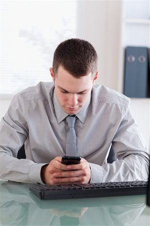 simsearch:400-05710264,k - Close up of businessman reading text message carefully Stock Photo - Budget Royalty-Free & Subscription, Code: 400-05710275