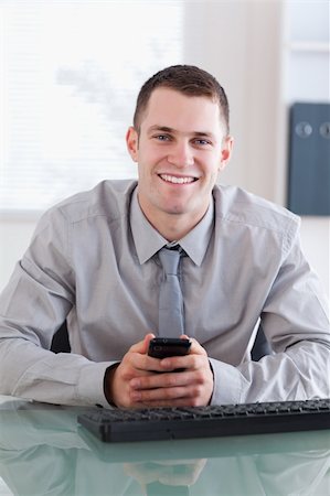 simsearch:400-05710264,k - Close up of smiling businessman getting a text message Stock Photo - Budget Royalty-Free & Subscription, Code: 400-05710273