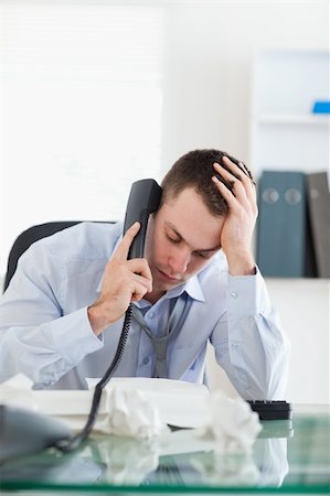 simsearch:400-05710264,k - Close up of frustrated businessman looking at an invoice while on the phone Stock Photo - Budget Royalty-Free & Subscription, Code: 400-05710300