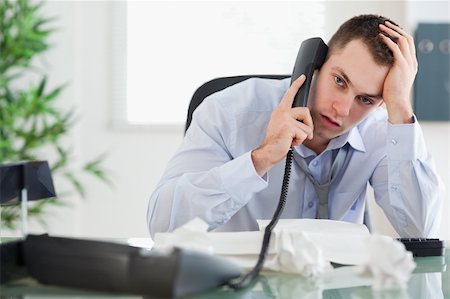 simsearch:400-05710264,k - Troubled young businessman on the phone Stock Photo - Budget Royalty-Free & Subscription, Code: 400-05710302