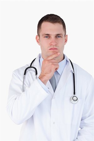 simsearch:400-05710403,k - Close up of doctor lost in thought on white background Stock Photo - Budget Royalty-Free & Subscription, Code: 400-05710965