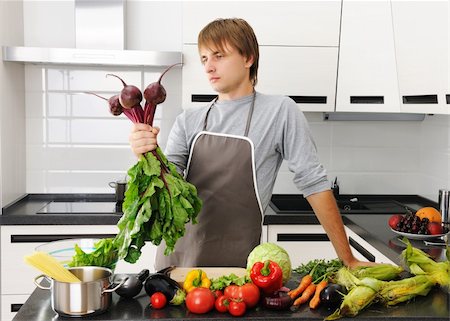 simsearch:400-05744780,k - Man cooking in modern kitchen Stock Photo - Budget Royalty-Free & Subscription, Code: 400-05711600