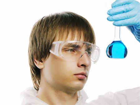 simsearch:400-04340735,k - Scientist in protective wear and glasses looking at flask with reagent Stock Photo - Budget Royalty-Free & Subscription, Code: 400-05711626