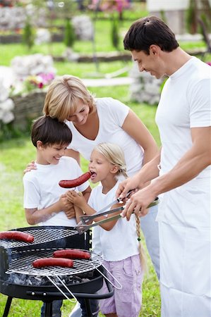 Family with children does barbecue Stock Photo - Budget Royalty-Free & Subscription, Code: 400-05711797