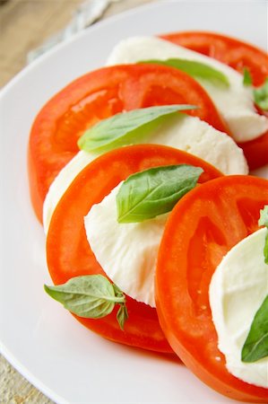 simsearch:700-01099893,k - Traditional Italian Caprice salad tomato mozzarella cheese and basil Stock Photo - Budget Royalty-Free & Subscription, Code: 400-05724264