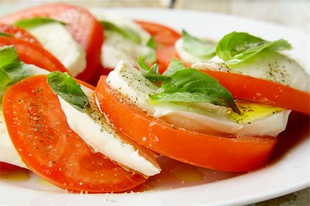 simsearch:700-01099893,k - Traditional Italian Caprice salad tomato mozzarella cheese and basil Stock Photo - Budget Royalty-Free & Subscription, Code: 400-05724262
