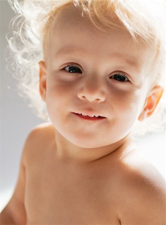 Smiling child in sun light Stock Photo - Budget Royalty-Free & Subscription, Code: 400-05728098