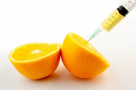 food specialist - detail of a injection and a orange Photographie de stock - Aubaine LD & Abonnement, Code: 400-05728495