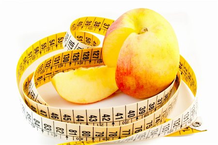 food specialist - detail of cutted apple with measuring tape Stock Photo - Budget Royalty-Free & Subscription, Code: 400-05728492