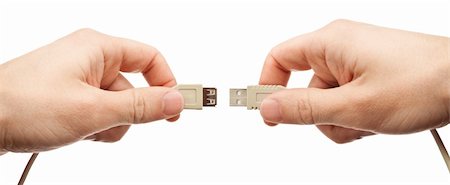 Hands connecting usb cable, isolated. Stock Photo - Budget Royalty-Free & Subscription, Code: 400-05728657