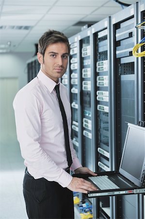simsearch:400-04239432,k - young handsome business man  engeneer in datacenter server room Stock Photo - Budget Royalty-Free & Subscription, Code: 400-05728666