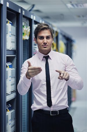 simsearch:400-05881495,k - young handsome business man  engeneer in datacenter server room Stock Photo - Budget Royalty-Free & Subscription, Code: 400-05728793