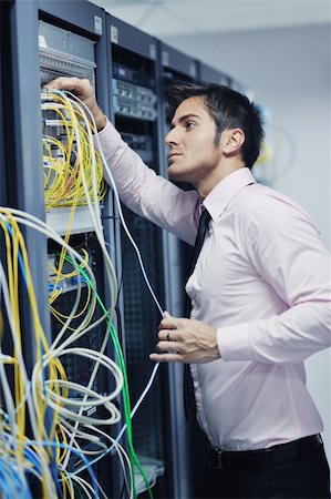 simsearch:400-05291415,k - young handsome business man  engeneer in datacenter server room Stock Photo - Budget Royalty-Free & Subscription, Code: 400-05728806