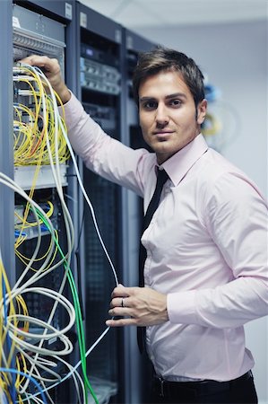 simsearch:400-05881495,k - young handsome business man  engeneer in datacenter server room Stock Photo - Budget Royalty-Free & Subscription, Code: 400-05728808