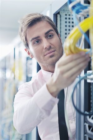 simsearch:400-05291415,k - young handsome business man  engeneer in datacenter server room Stock Photo - Budget Royalty-Free & Subscription, Code: 400-05728819