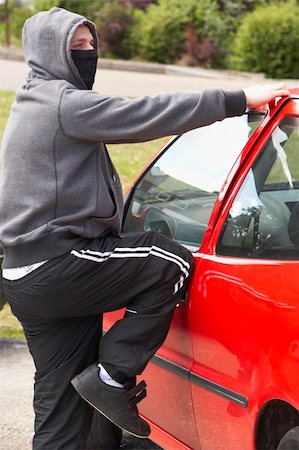 simsearch:400-05729552,k - Young Man Breaking Into Car Stock Photo - Budget Royalty-Free & Subscription, Code: 400-05729547