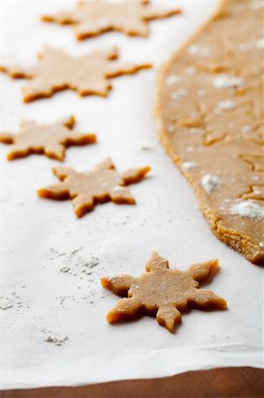 simsearch:400-05721521,k - Making gingerbread cookies for Christmas. Gingerbread dough with star shapes. Stock Photo - Budget Royalty-Free & Subscription, Code: 400-05721519