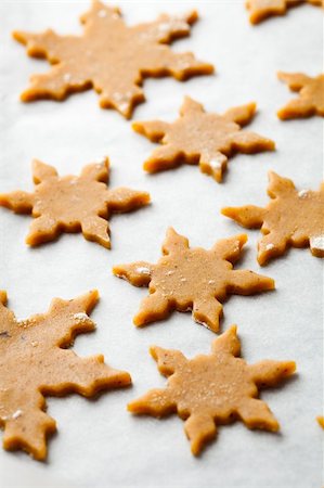 simsearch:400-05721521,k - Making gingerbread cookies for Christmas. Gingerbread dough with star shapes. Stock Photo - Budget Royalty-Free & Subscription, Code: 400-05721520