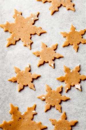 simsearch:400-05721521,k - Making gingerbread cookies for Christmas. Gingerbread dough with star shapes. Stock Photo - Budget Royalty-Free & Subscription, Code: 400-05721521