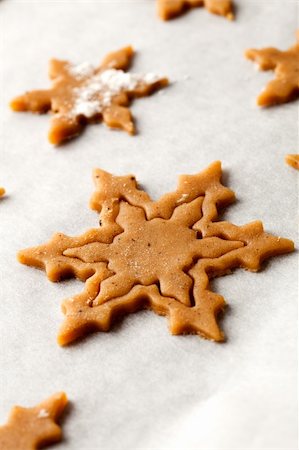 simsearch:400-05721521,k - Making gingerbread cookies for Christmas. Gingerbread dough with star shapes. Stock Photo - Budget Royalty-Free & Subscription, Code: 400-05721522