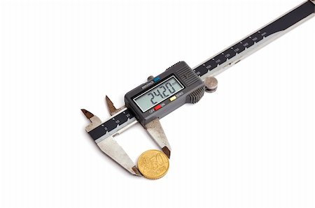 dial (measuring gauge) - electronic calipers and coin on a white background Photographie de stock - Aubaine LD & Abonnement, Code: 400-05722012
