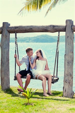 simsearch:400-05328142,k - Bride and groom on the tropical beach Stock Photo - Budget Royalty-Free & Subscription, Code: 400-05722878