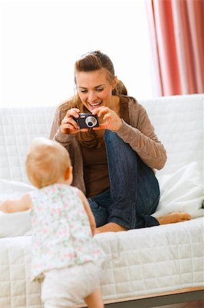 simsearch:400-05899085,k - Modern mother making photos of baby at home Foto de stock - Super Valor sin royalties y Suscripción, Código: 400-05723086
