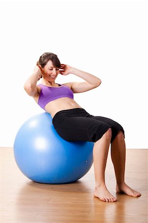 simsearch:400-04180657,k - Beautiful young and athletic woman making exercises on a fitness ball Stock Photo - Budget Royalty-Free & Subscription, Code: 400-05734380