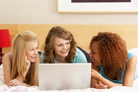 simsearch:400-05697169,k - Group Of Three Teenage Girls Using Laptop In Bedroom Stock Photo - Budget Royalty-Free & Subscription, Code: 400-05734757