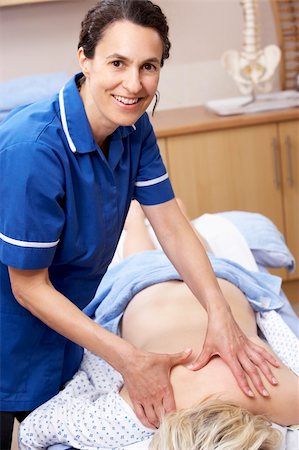 Osteopath treating female client Stock Photo - Budget Royalty-Free & Subscription, Code: 400-05735028