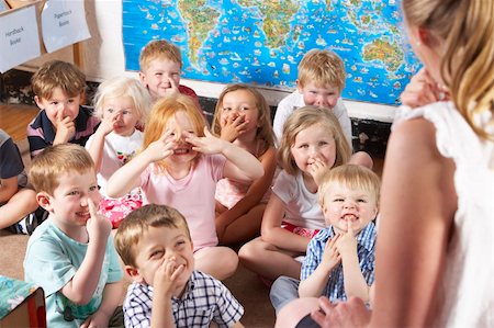 Montessori/Pre-School Class Listening to Teacher on Carpet Stock Photo - Budget Royalty-Free & Subscription, Code: 400-05735279