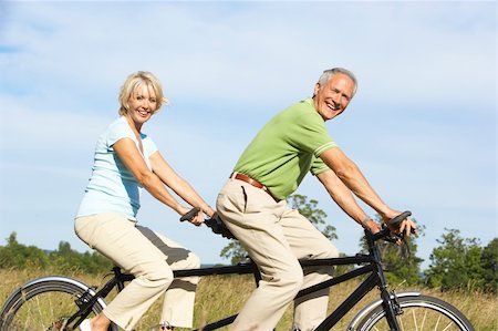 Mature couple riding tandem Stock Photo - Budget Royalty-Free & Subscription, Code: 400-05736040