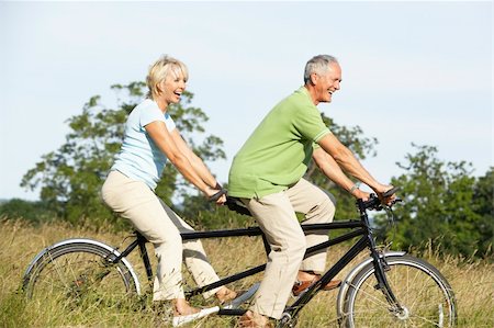 Mature couple riding tandem Stock Photo - Budget Royalty-Free & Subscription, Code: 400-05736043