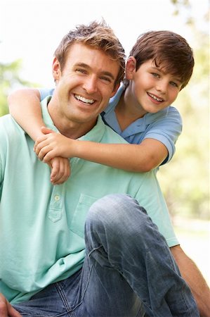 Portrait Of Father And Son In Park Stock Photo - Budget Royalty-Free & Subscription, Code: 400-05736073