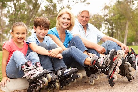 Grandparents And Grandchildren Putting On In Line Skates In Park Stock Photo - Budget Royalty-Free & Subscription, Code: 400-05736216